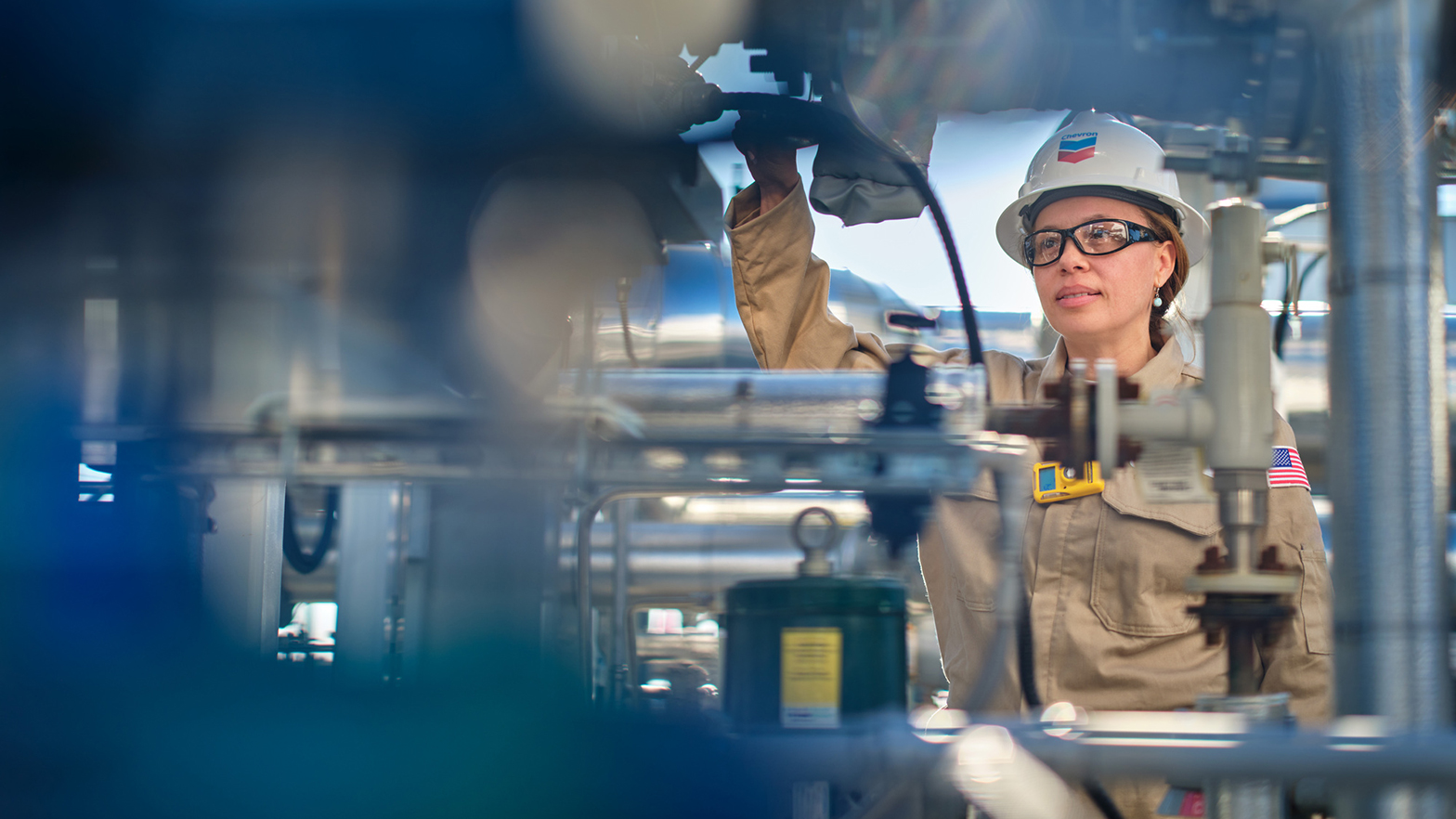 Svante tech trial facility, San Joaquin Valley, Bakersfield. Worker analyzing a CO2 capture system.