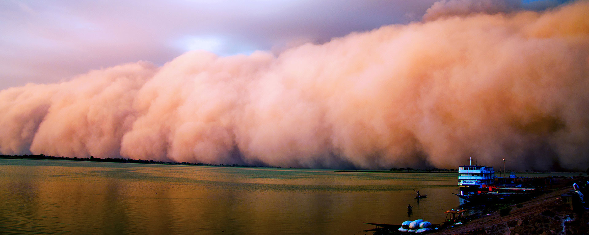 large clouds roll over the water
